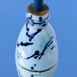 Candeliere in ceramica blu con 4 candele profumate
