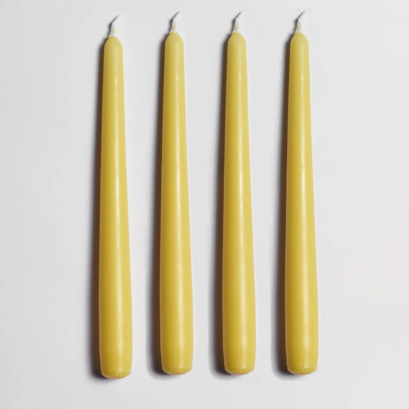 Candeliere in ceramica gialla con 4 candele profumate