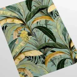 Carta da parati verde e gialla con foglie di banano