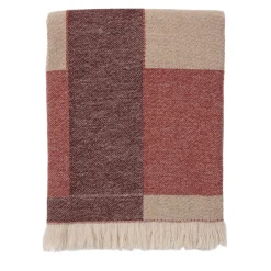 Coperta rossa con frange e motivi intrecciati