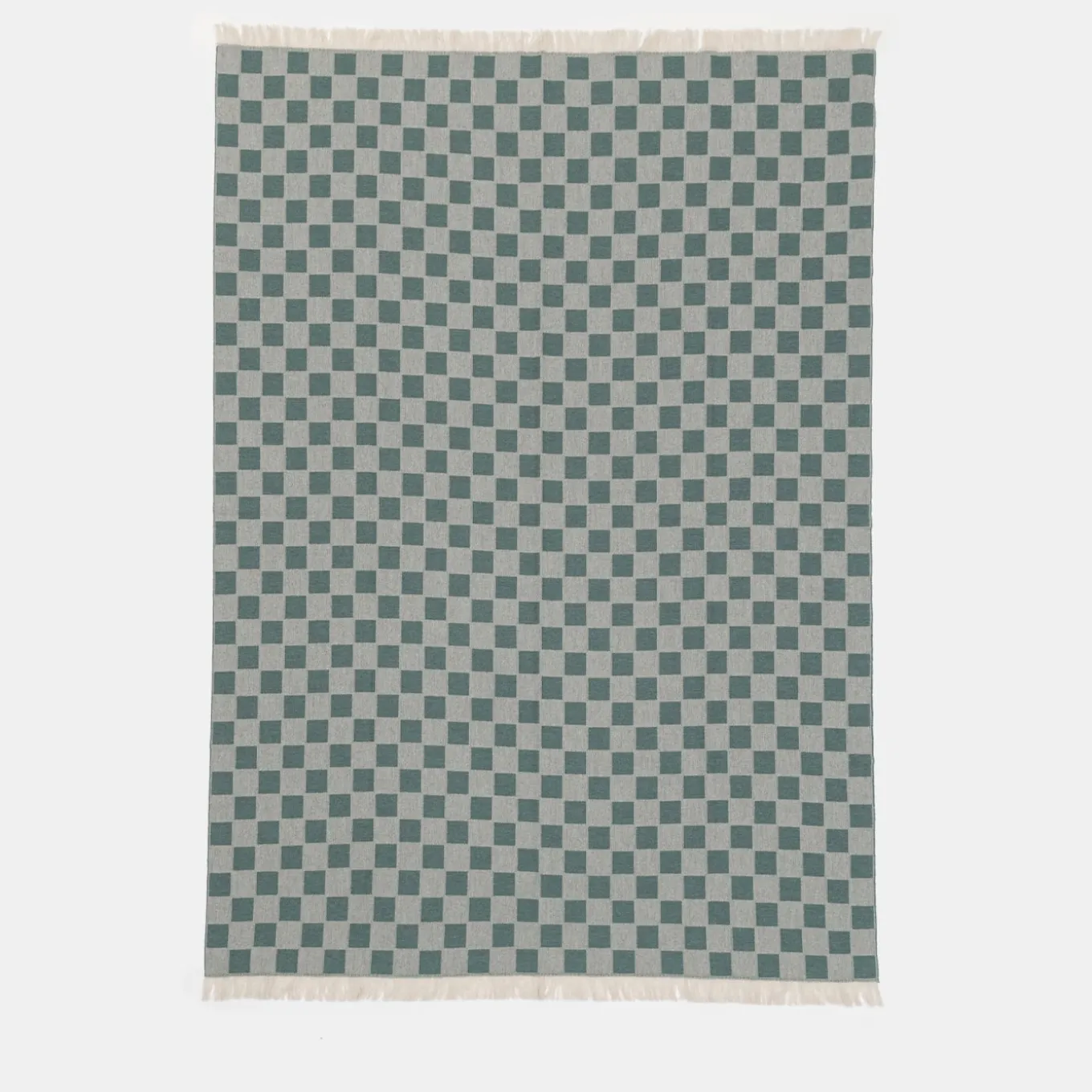 Coperta verde con frange a scacchiera