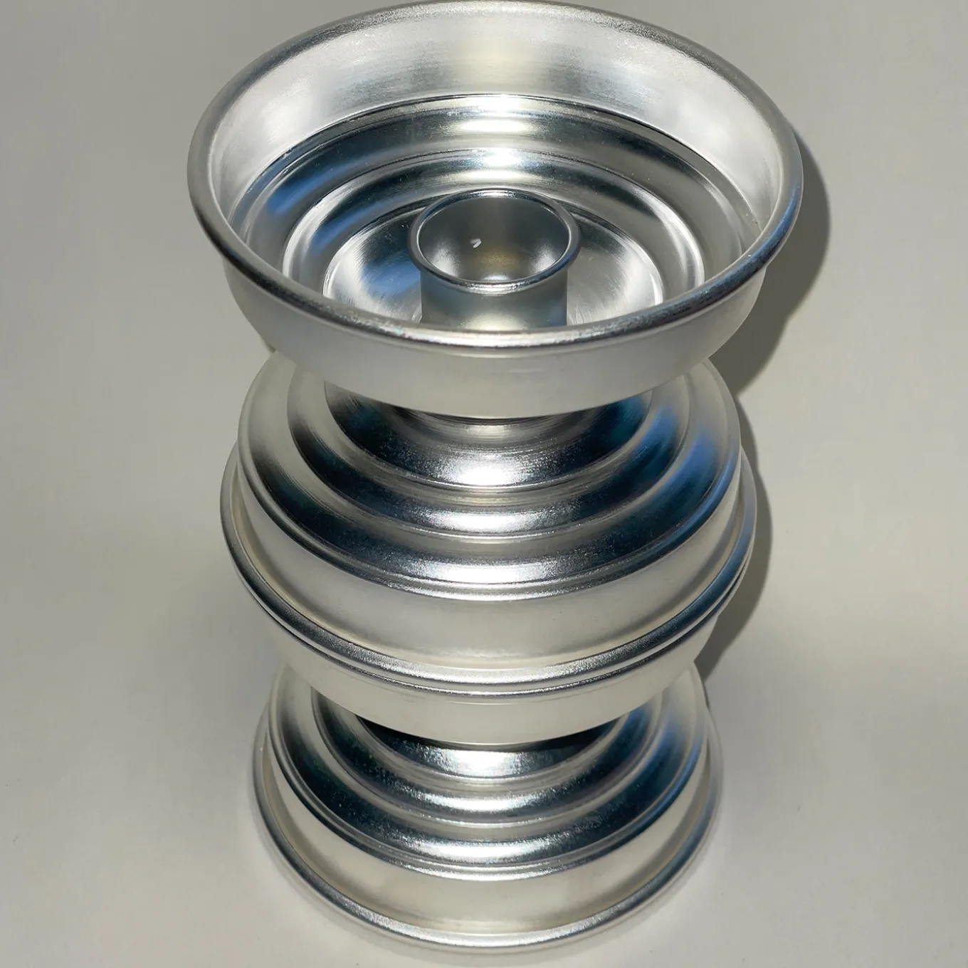 Portacandele scultoreo in ottone placcato argento