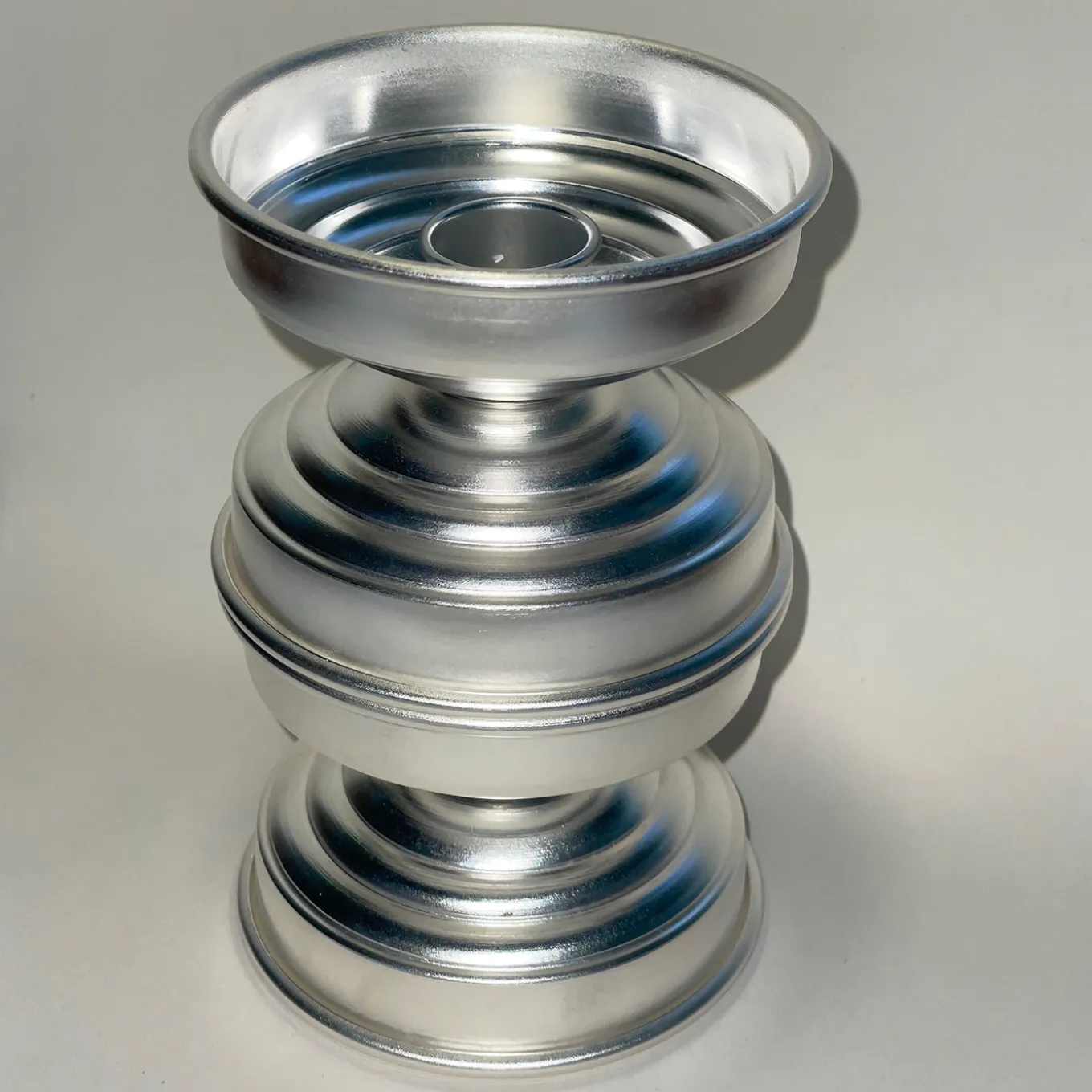Portacandele scultoreo in ottone placcato argento