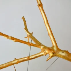 Scultura in oro di Rami Sospesi