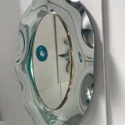 Specchio ovale ondulato